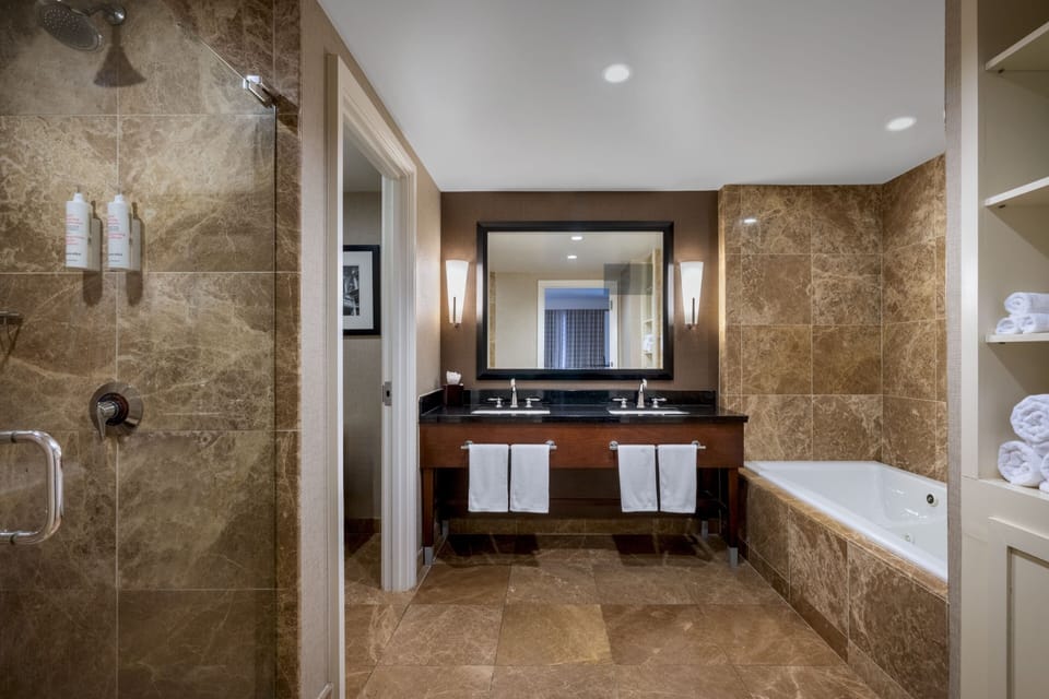 Combined shower/tub, designer toiletries, hair dryer, bathrobes