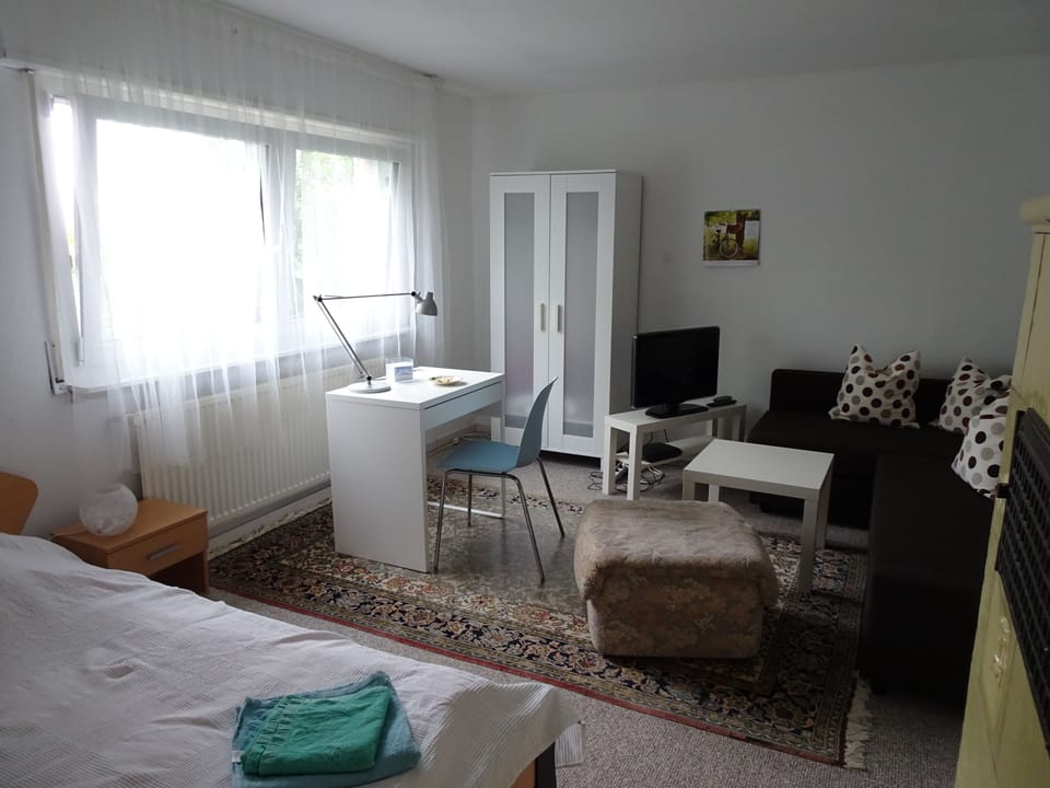 Standard Double Room, Garden View | Living area | 22-inch flat-screen TV with digital channels