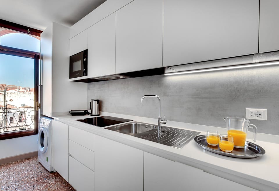 Suite, 2 Bedrooms, Canal View | Private kitchen | Full-size fridge, stovetop, griddle, toaster oven