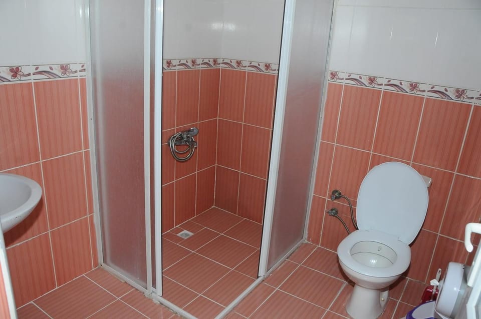 Shower, rainfall showerhead, hair dryer, towels