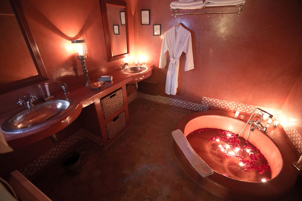 Designer toiletries, hair dryer, bathrobes, towels