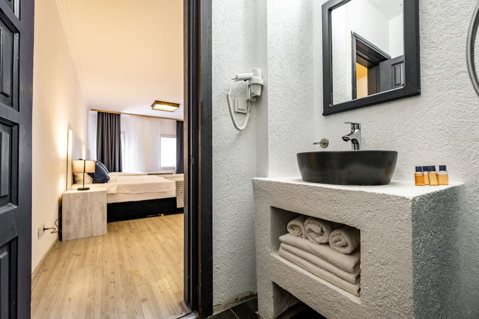 Family Room | Bathroom | Shower, free toiletries, slippers, towels