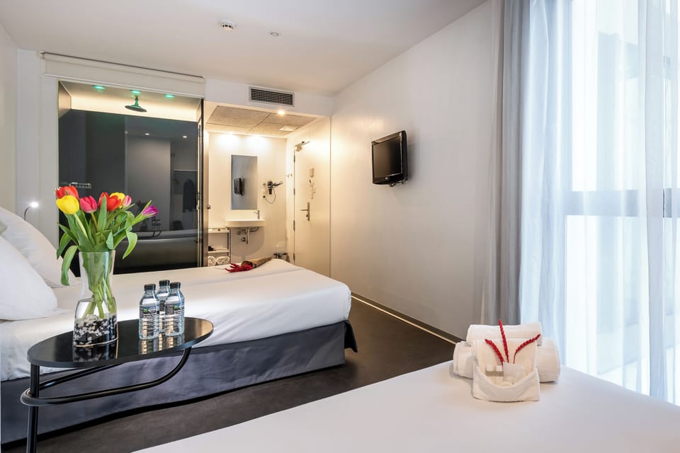 Triple Room | Down comforters, blackout drapes, iron/ironing board, free WiFi