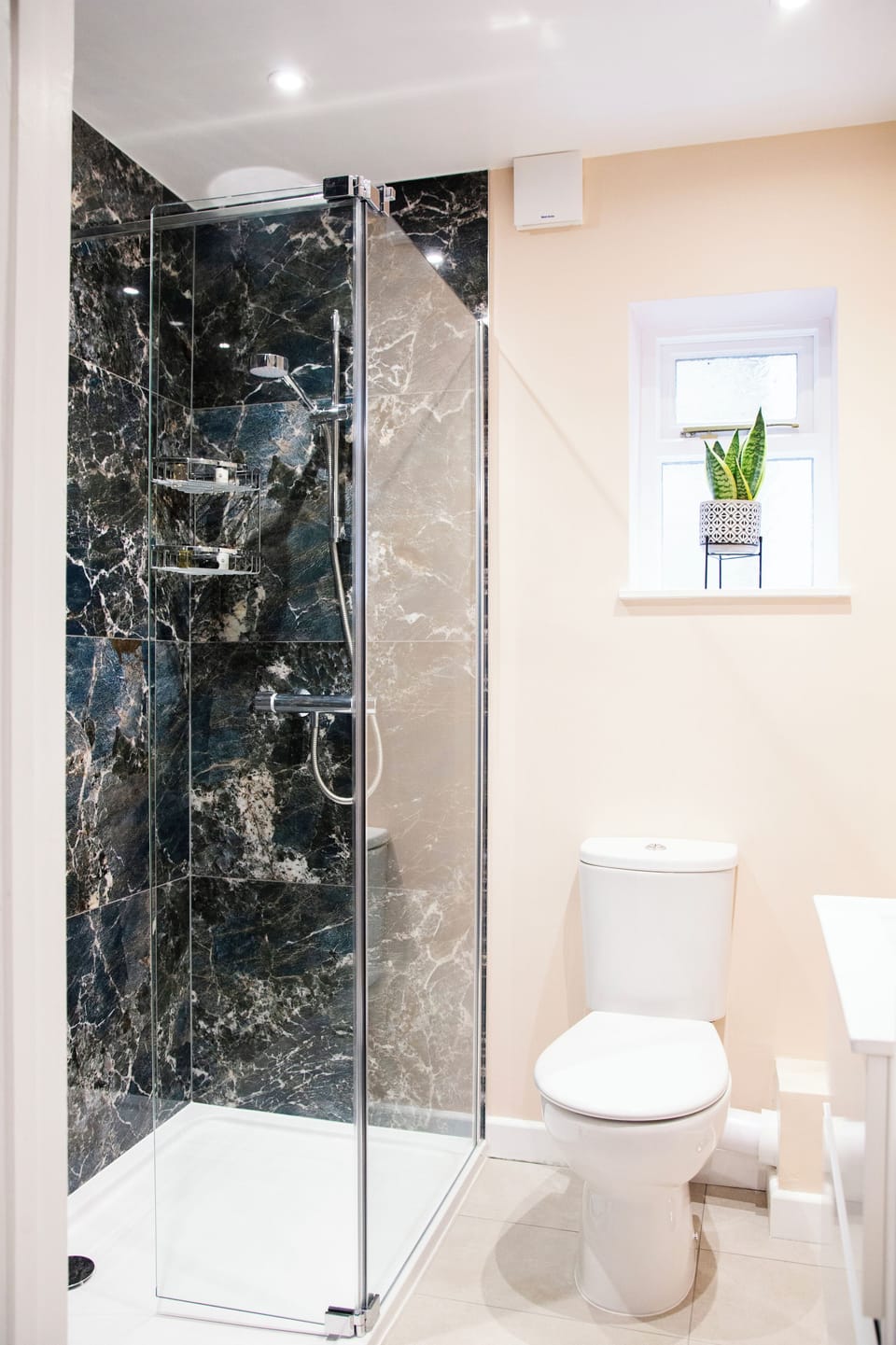 Shower, designer toiletries, hair dryer, towels