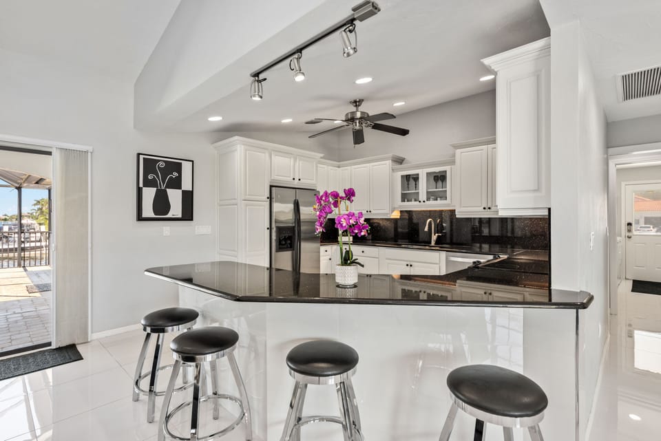Kitchen features granite counters, stainless appliances, coffee maker and Keurig