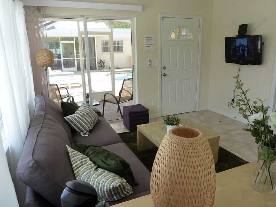 living area with adjacent, screened outdoor area