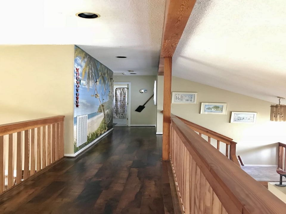 Bridge to blue and yellow bedrooms