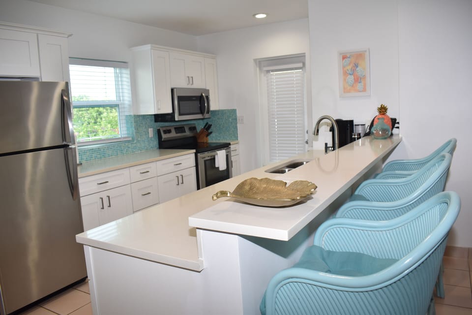 Brand new cabinetry and stainless steel appliances including dishwasher