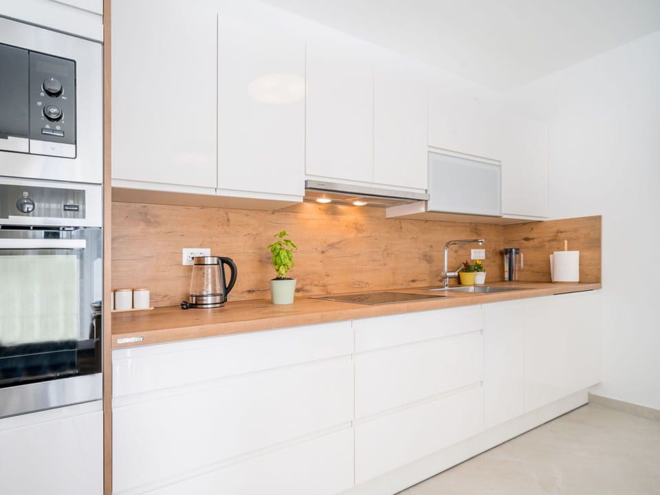 Kitchen, Property, Room, Cabinetry, Countertop, Furniture, Interior Design, Yellow, Tile, House