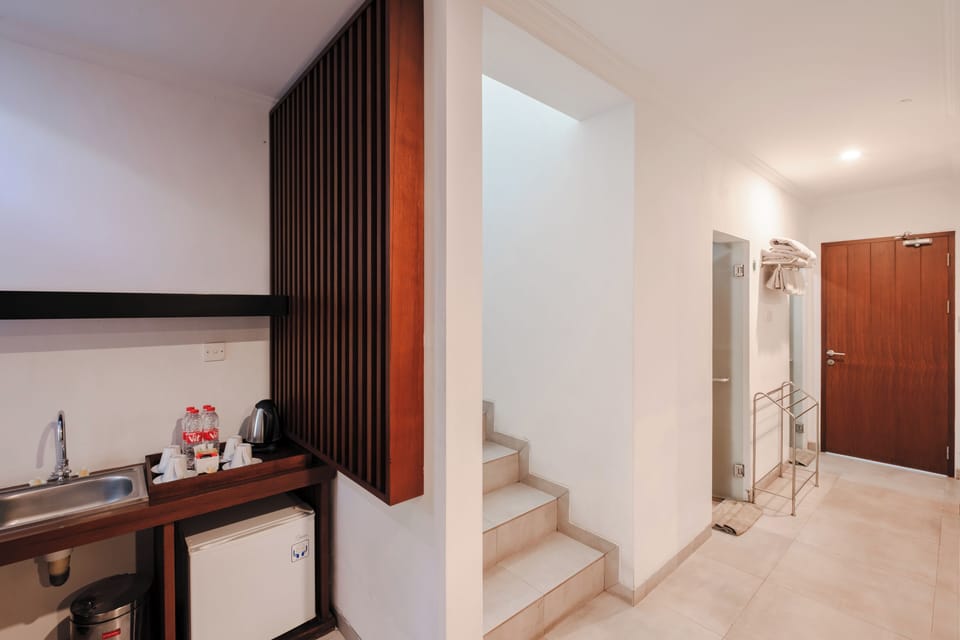 Junior Suite, Pool View | Living area | Flat-screen TV
