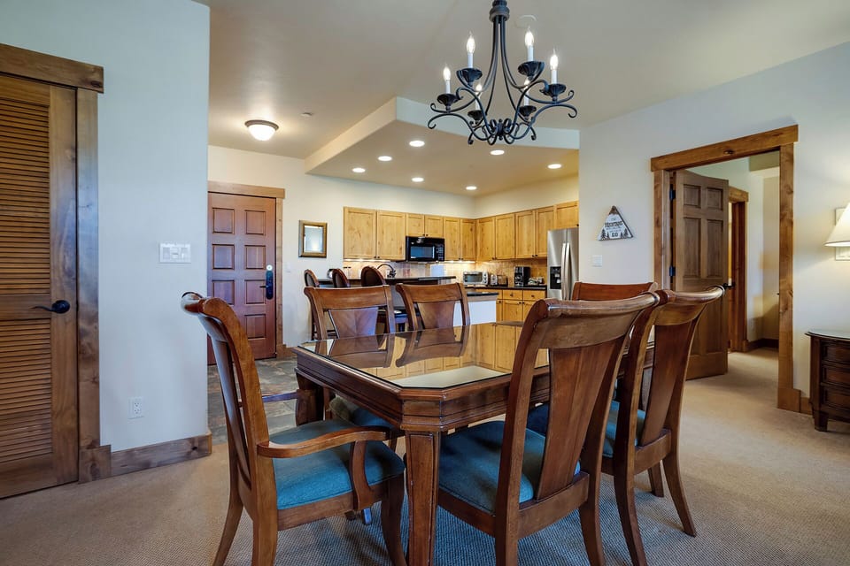 Gather around your elegant dining table for memorable meals in this spacious open-plan living area with fully equipped kitchen.
