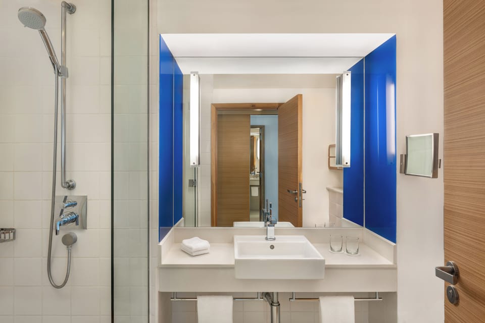 Designer toiletries, hair dryer, slippers, bidet