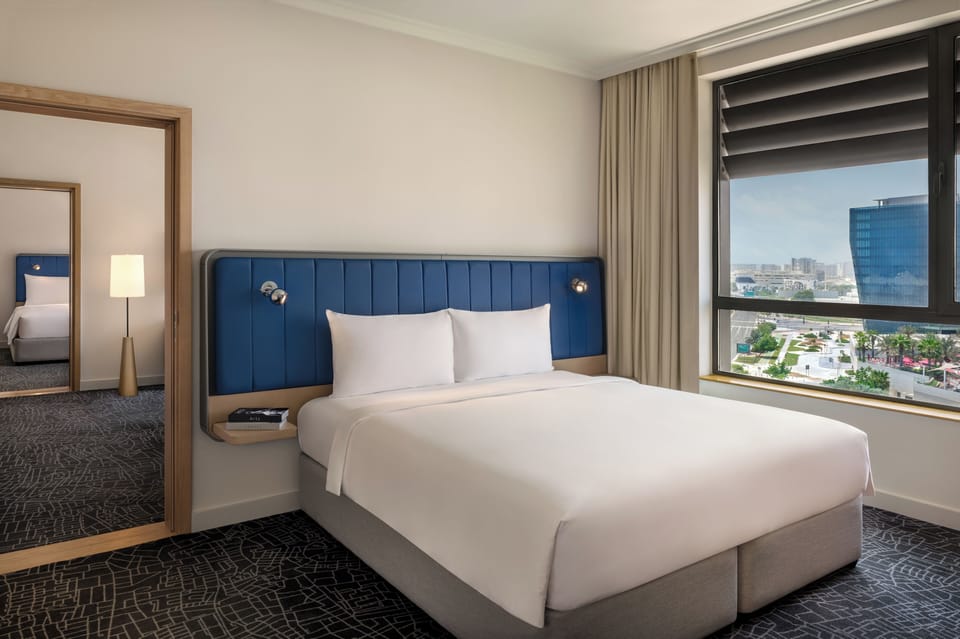 Suite, 2 Bedrooms (Plaza View, Theme Park Access) | Down comforters, Select Comfort beds, minibar, in-room safe