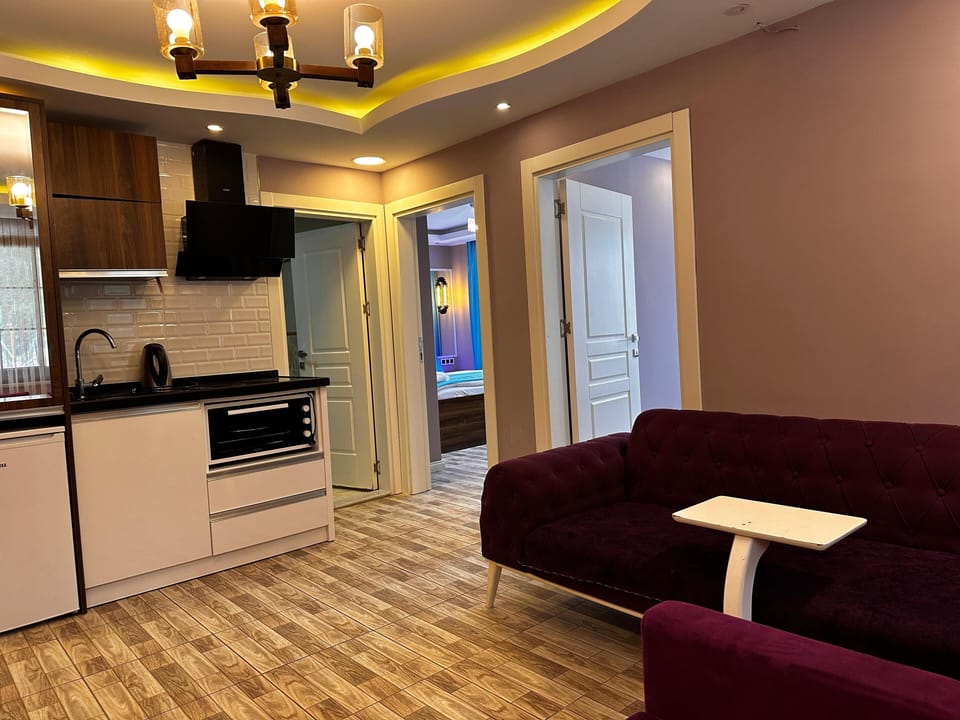 Family Suite, Lake View | Private kitchen | Fridge, eco-friendly cleaning products, paper towels