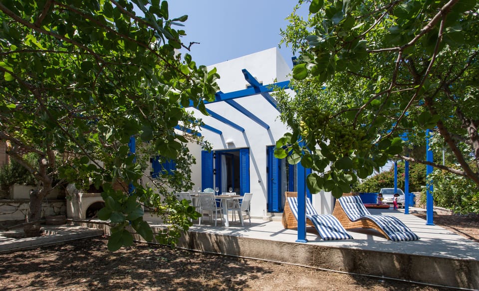 Terrace with loungers and dining table