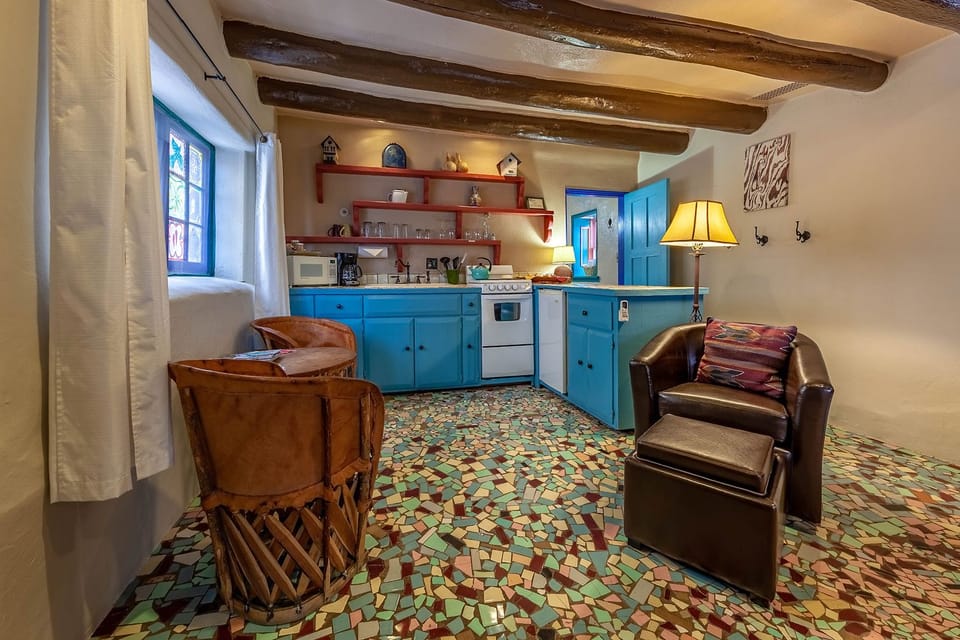 Deluxe Cottage, 1 Queen Bed, Hot Tub, Courtyard Area | Private kitchen | Shared fridge, microwave, coffee/tea maker