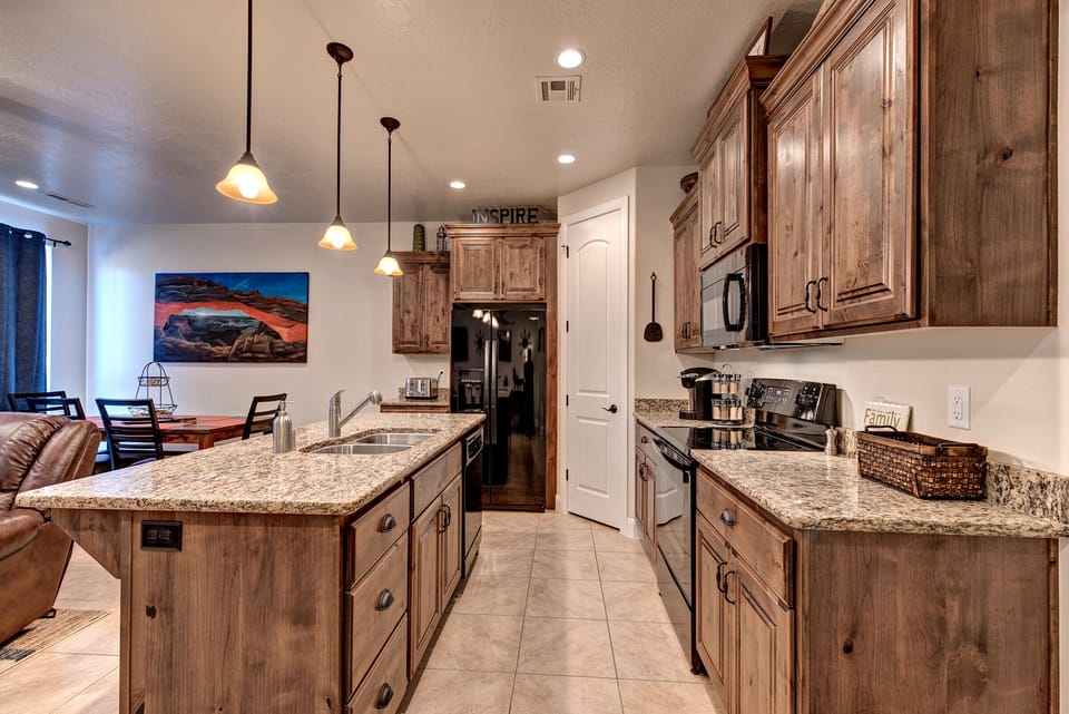 Side View of Kitchen - Side view of kitchen showing off the beautiful counter tops and stainless-steel appliances.