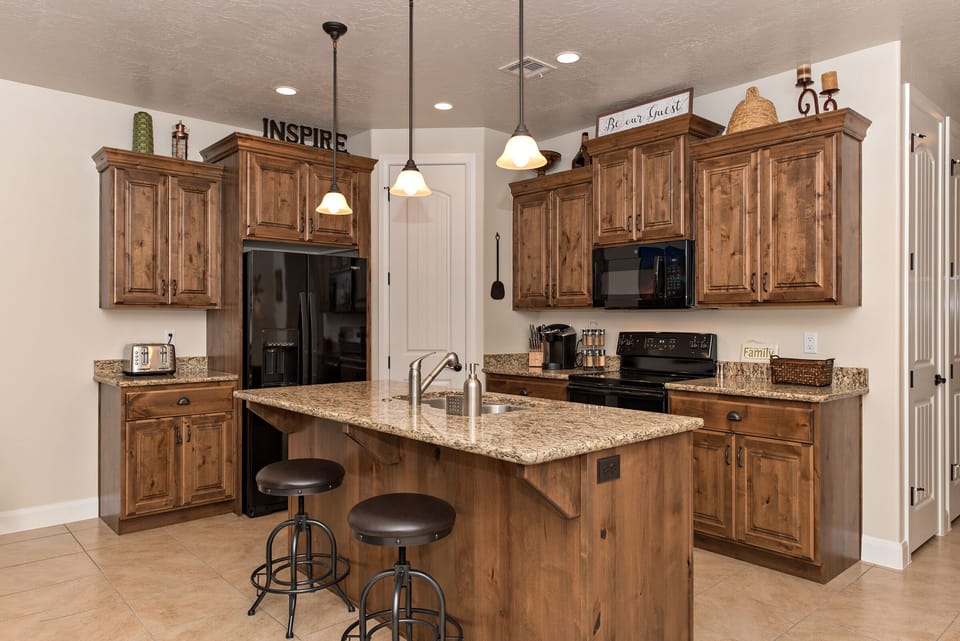 Kitchen - The Kitchen is complete with everything you will need for meal preparations including pots, pans, baking dishes, plates, cups, silverware, cutlery, and an assortment of cooking utensils