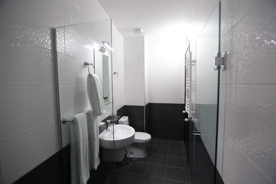 Shower, free toiletries, hair dryer, slippers