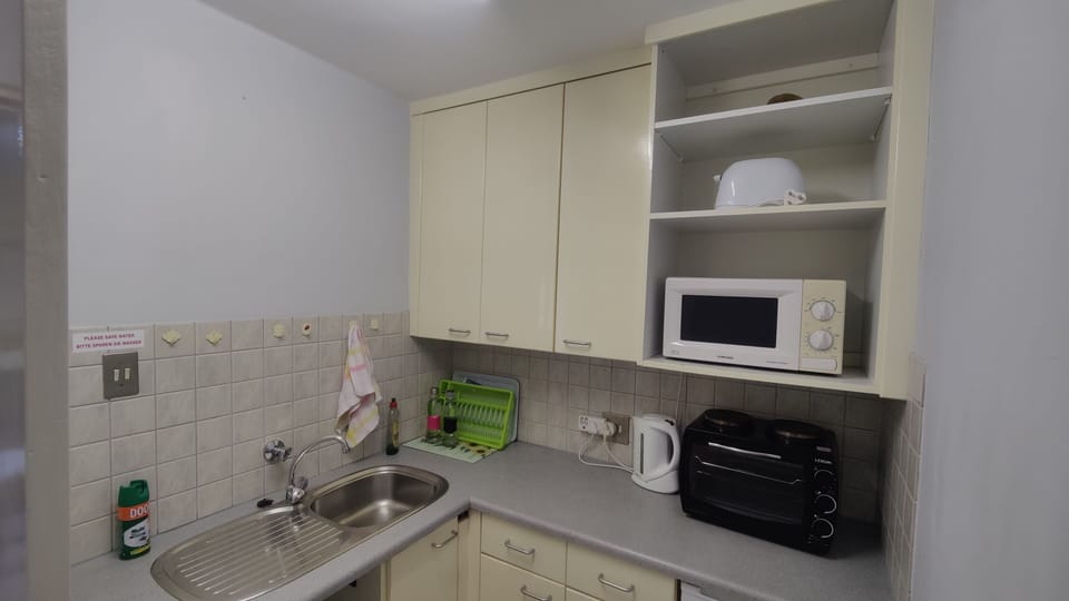 Family Room, Multiple Beds | Living area | Flat-screen TV