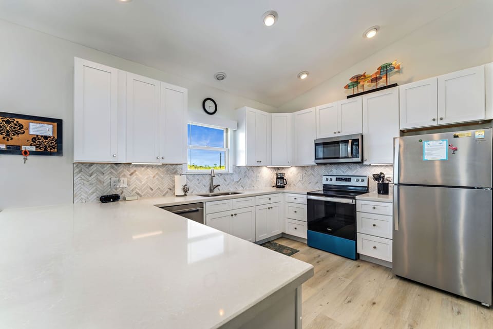 Kitchen is well equipped with loads of counterspace.