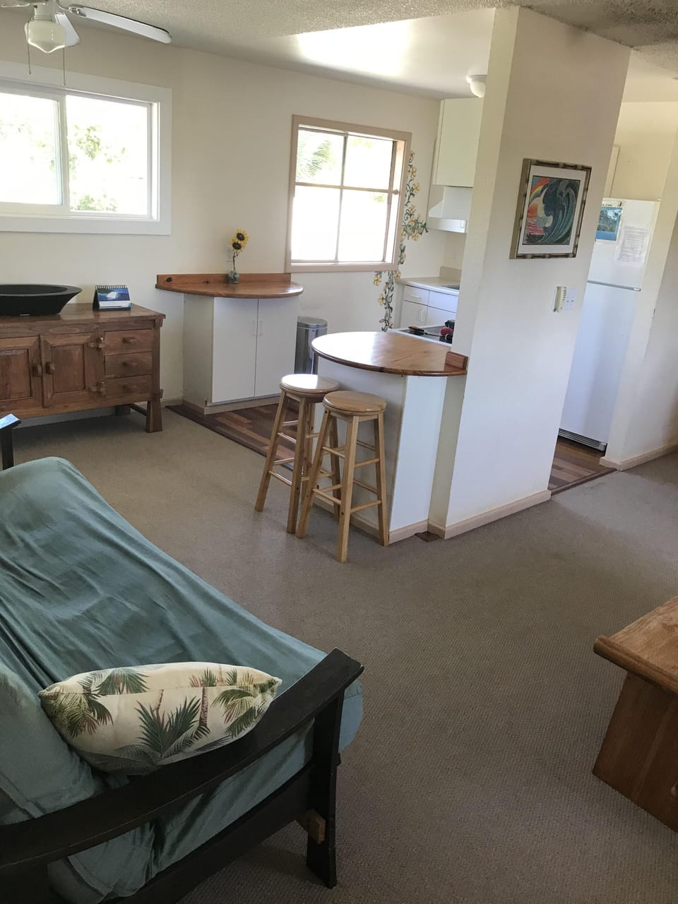 Another angle of the living room and kitchen