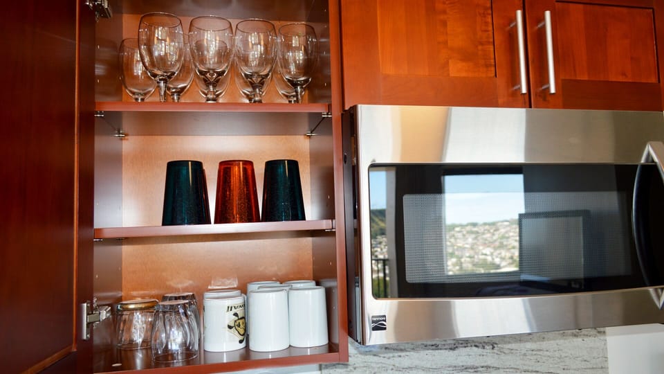 Fully equipped kitchen with dishes, glasses, silverware, pots and pans, etc.
