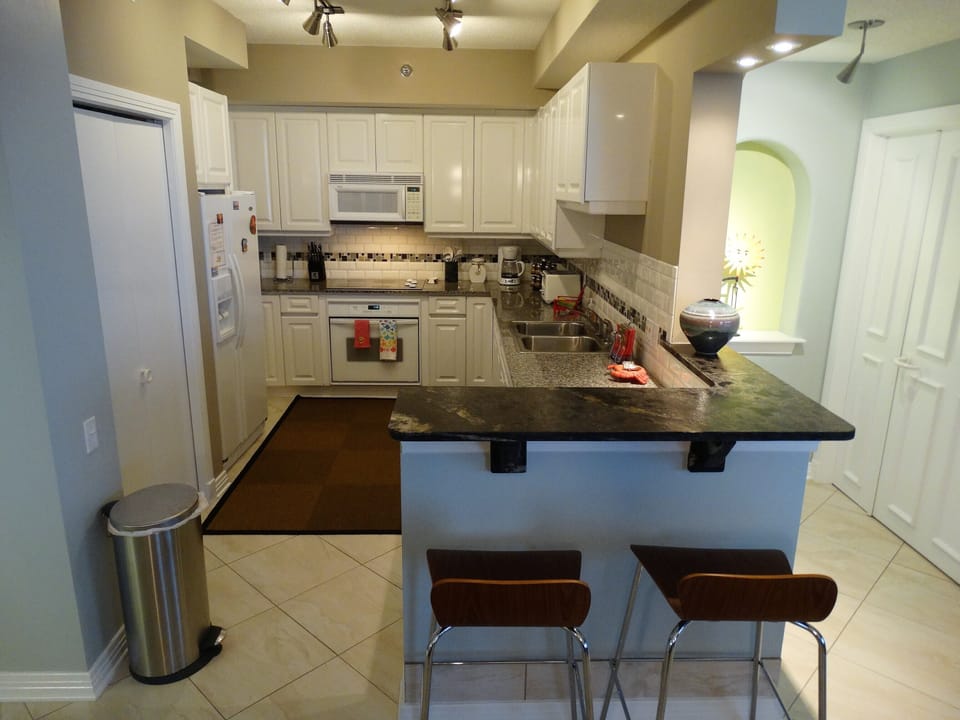 Kitchen is Outfitted with Granite Counter tops and a full set of Appliances 