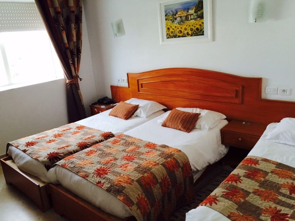 Triple Room | Free minibar, in-room safe, desk, blackout drapes