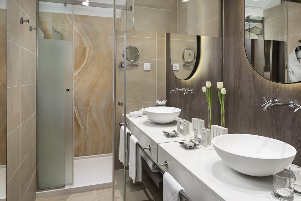 Designer toiletries, hair dryer, bathrobes, slippers