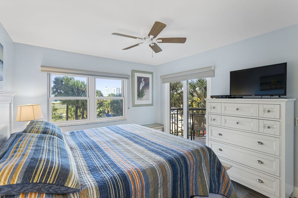Bedroom with King Size Bed, Balcony Access, and Ensuite Bathroom