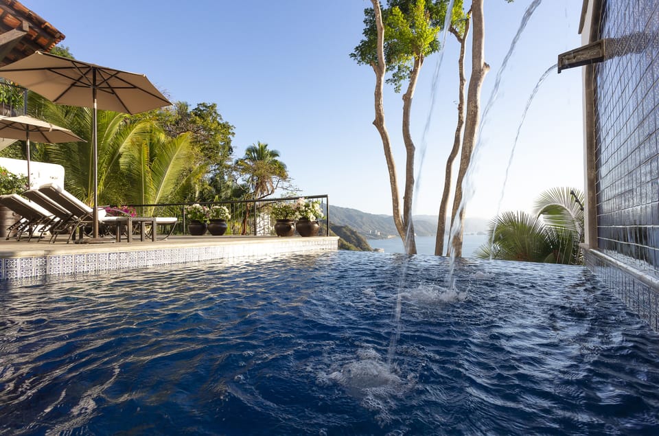 The infinity pool blurs the line between the pool and the beautiful blue Bay 