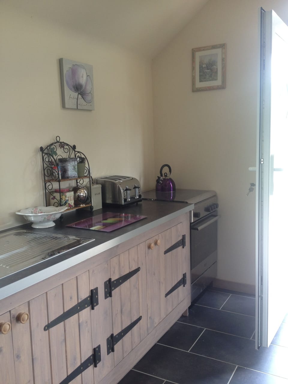 Kitchen with microwave, toaster and gas cooker