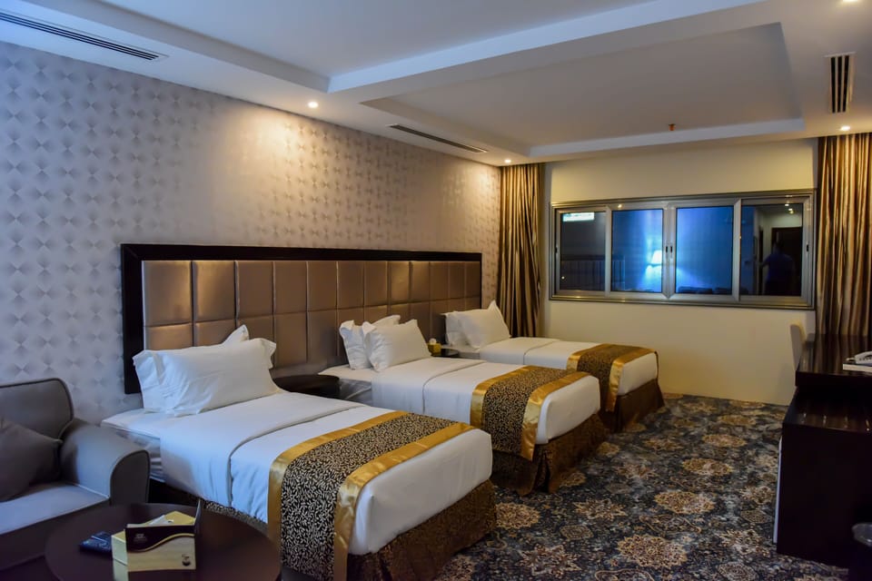 Triple Room | Minibar, in-room safe, desk, laptop workspace