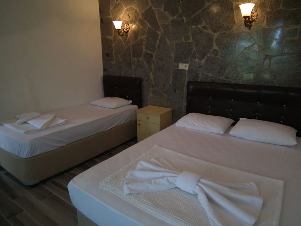 Triple Room, Lanai, Sea View | Free cribs/infant beds, bed sheets