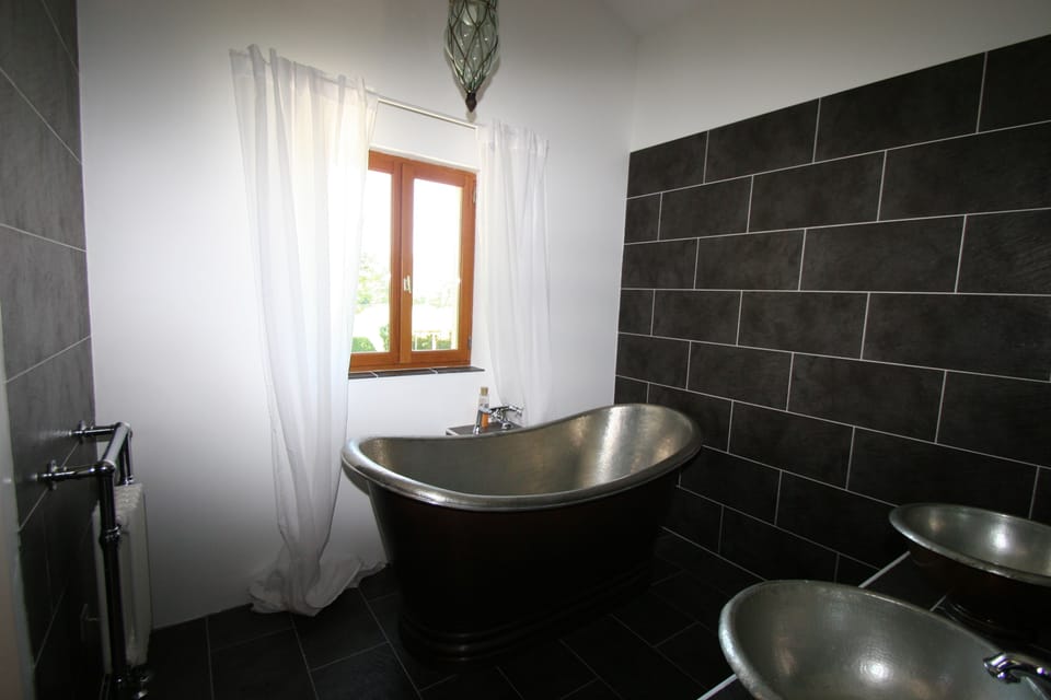 Master ensuite bath and shower room.