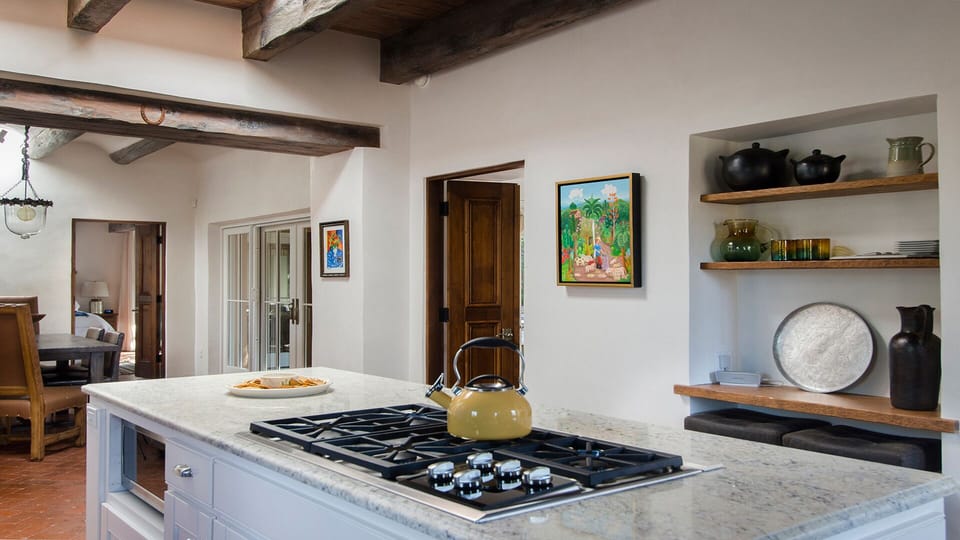 Kitchen looking to dining room. Wolfe stovetop.