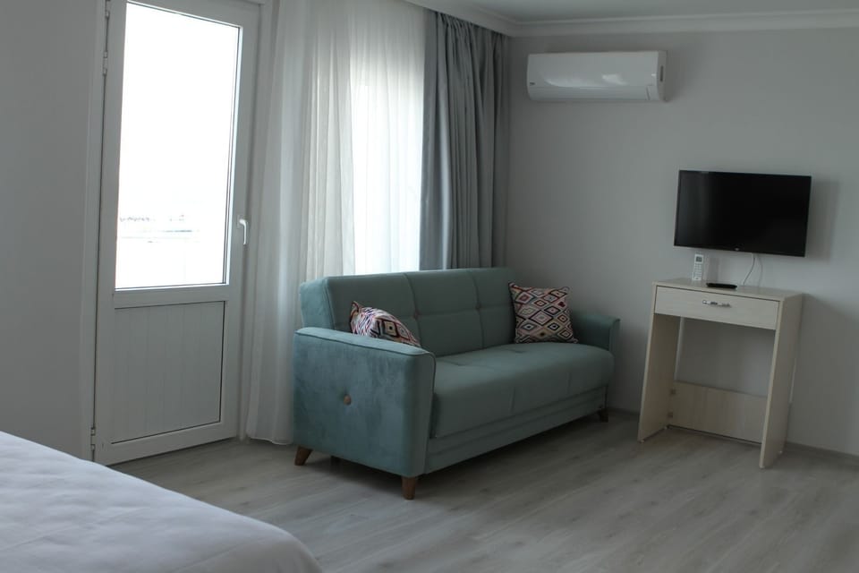 Deluxe Suite, 1 King Bed, Sea View | Living area | LED TV