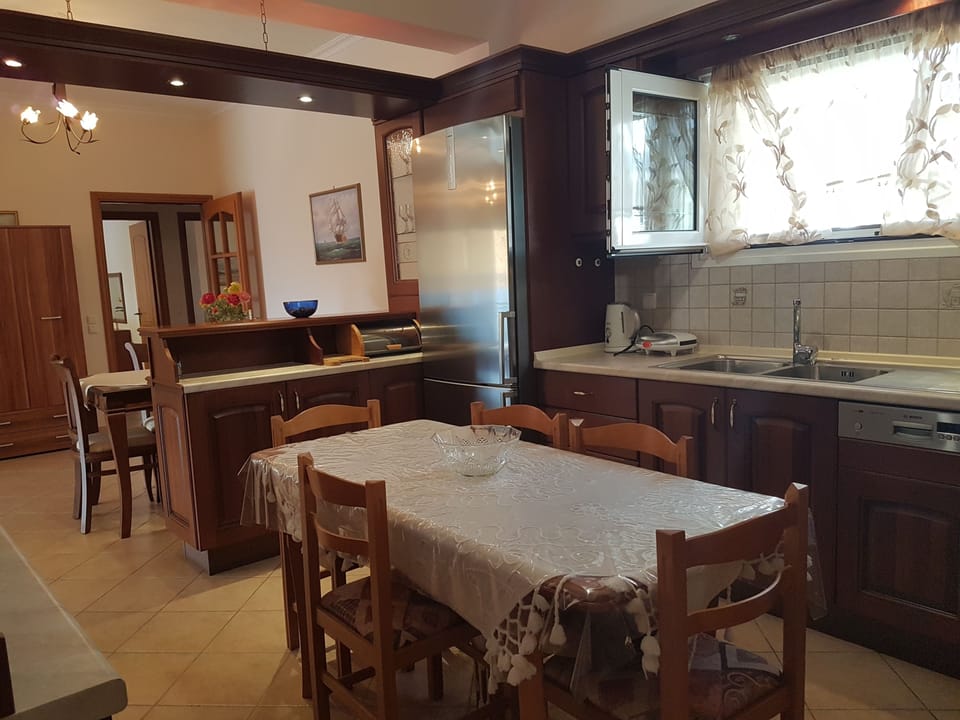 Apartment, Sea View | Living area | Flat-screen TV