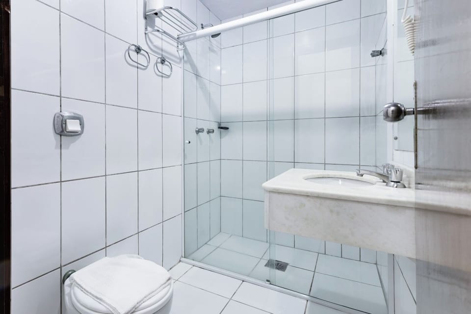 Shower, rainfall showerhead, designer toiletries, hair dryer