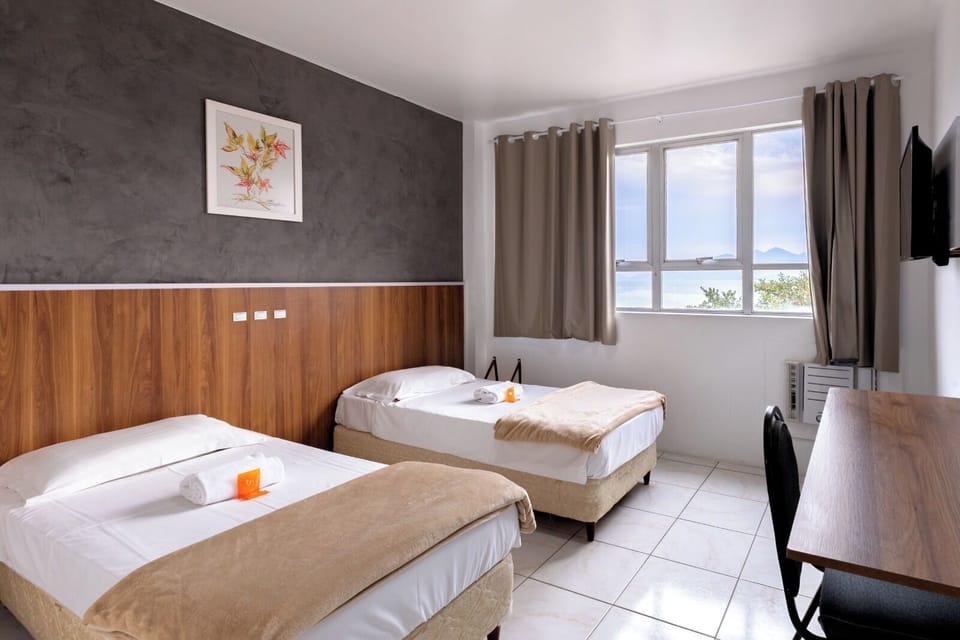 Deluxe Twin Room | Minibar, desk, laptop workspace, iron/ironing board (on request)