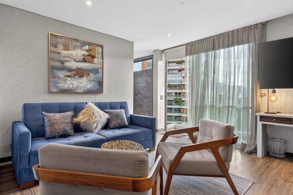 Suite | Living area | 50-inch flat-screen TV with cable channels, TV