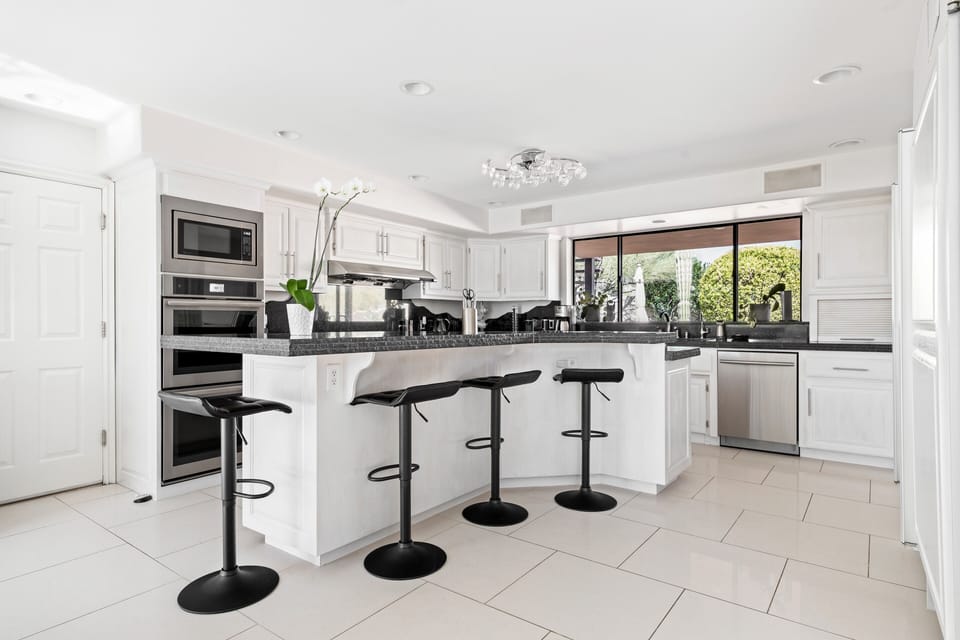 Kitchen and island with 4 bar stools. 
