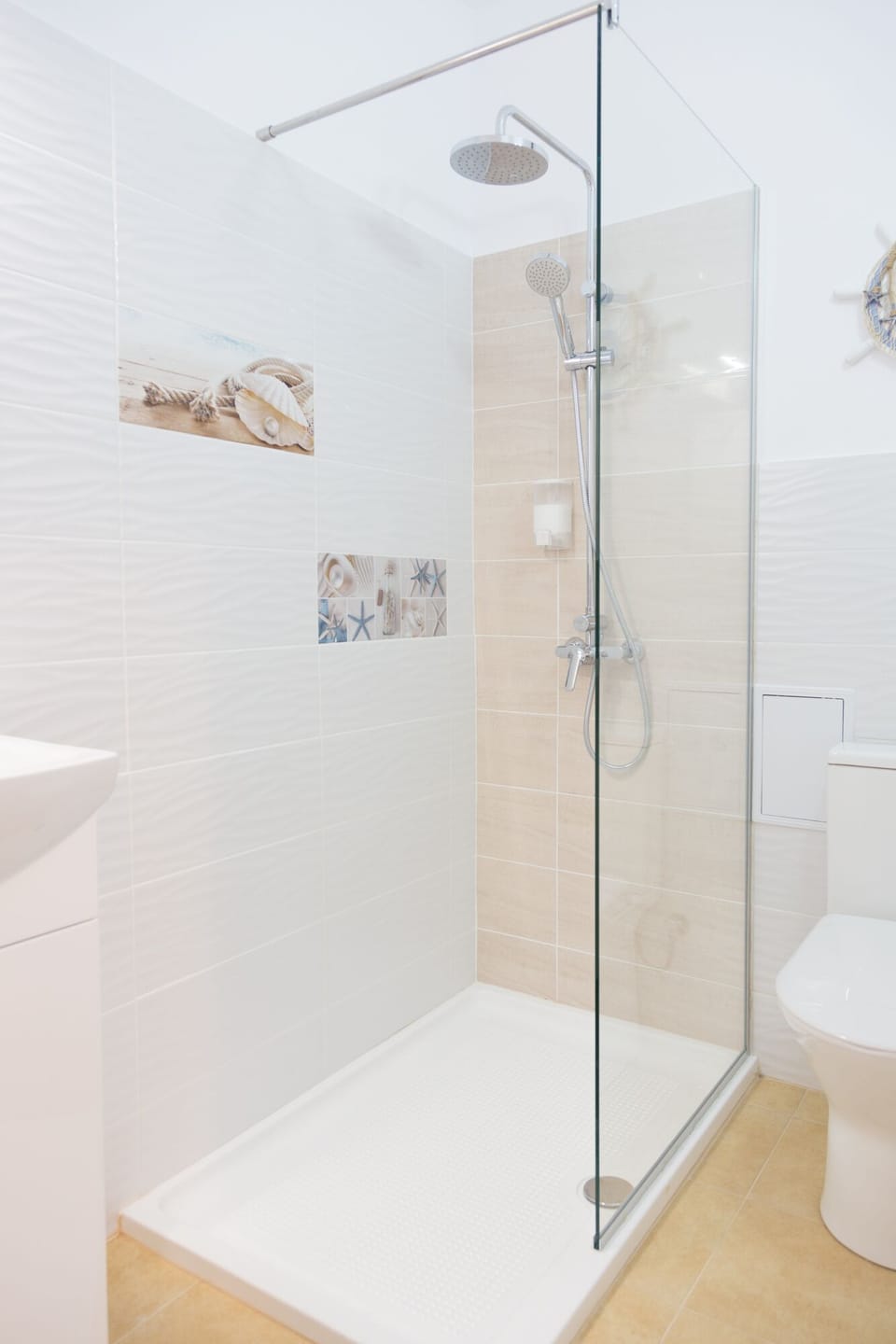 Bathroom with shower. Soap and shower-gel provided   
