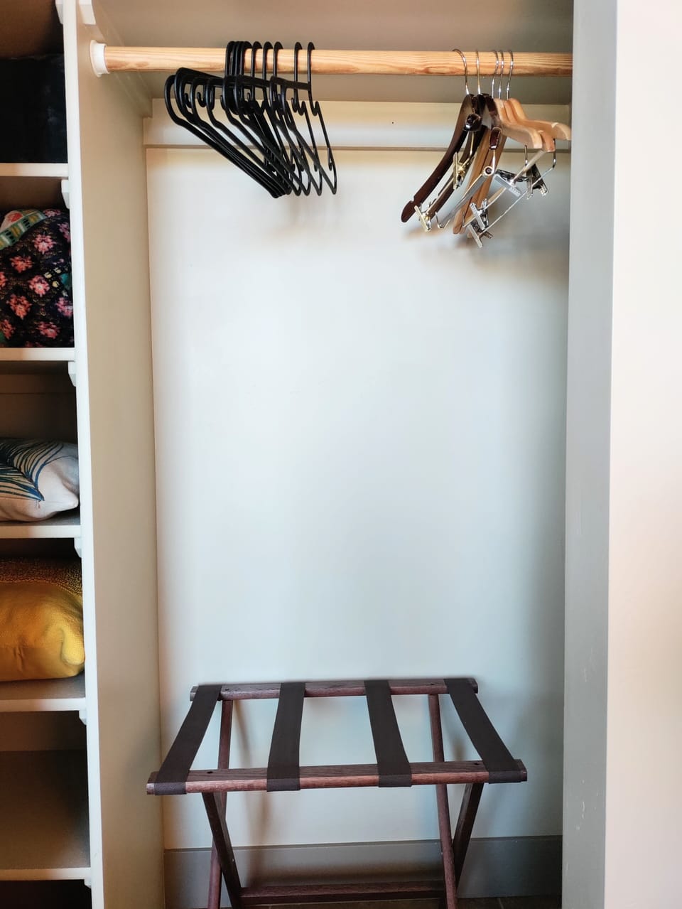 Spacious closets with two luggage racks.