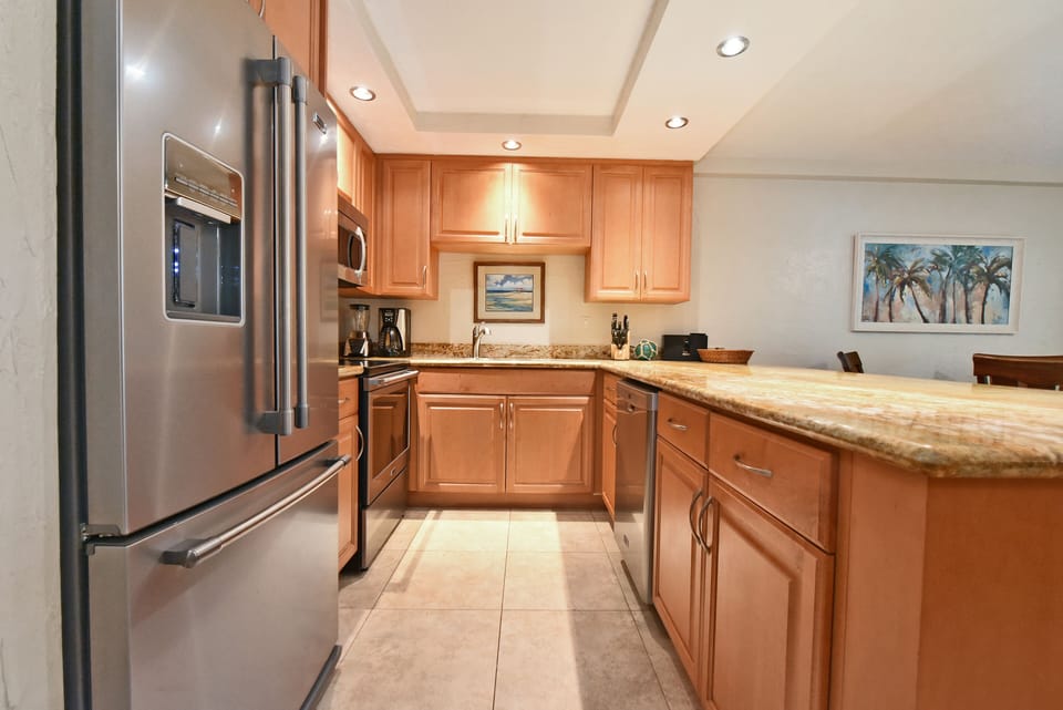 Cupboards filled with new dishware, cookware and utensils