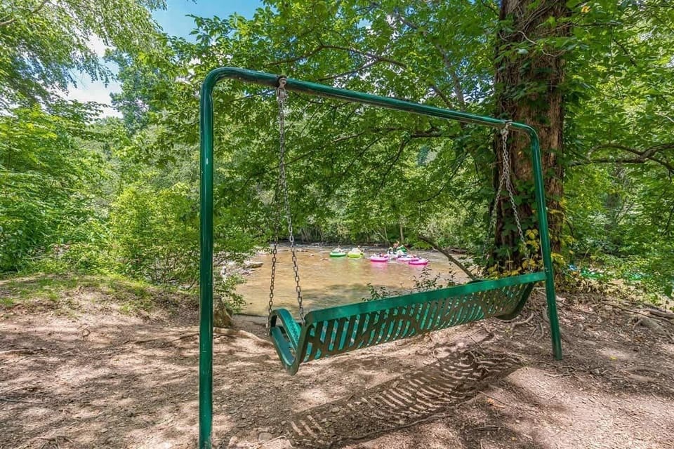 Slow down and enjoy a quiet moment by the river, surrounded by trees and fresh mountain air.