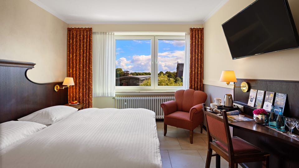 Comfort Double Room, Non Smoking | Living area | 45-inch plasma TV with cable channels, TV