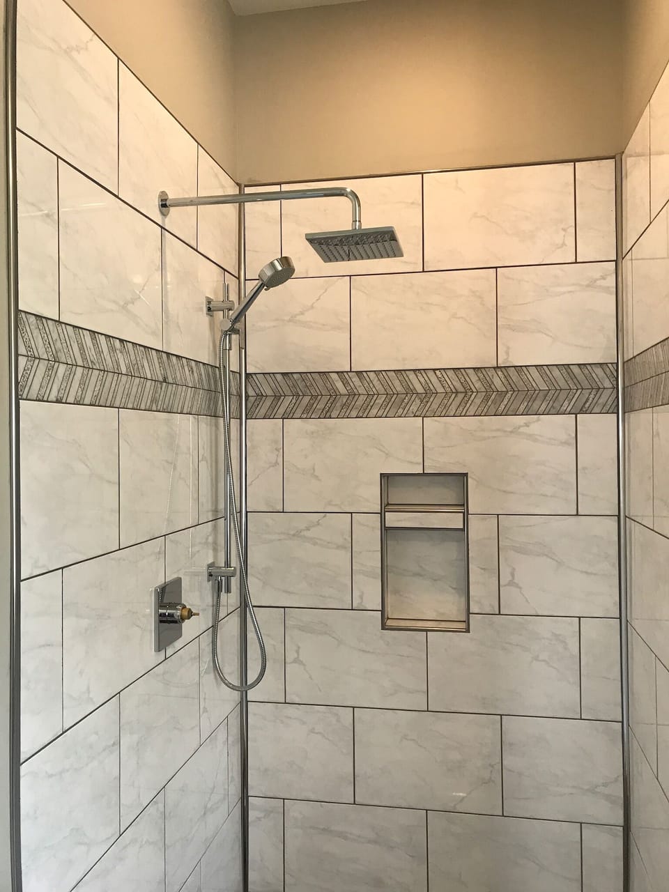 Luxurious rainhead shower with handheld option as well.  