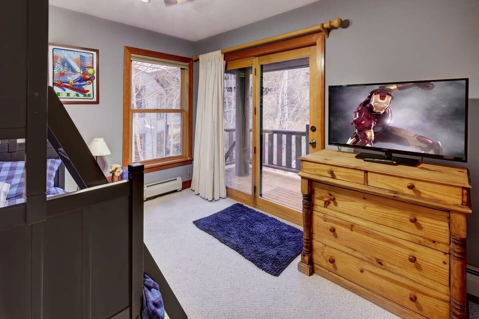 Bedroom with twin over queen bunk and flatscreen TV